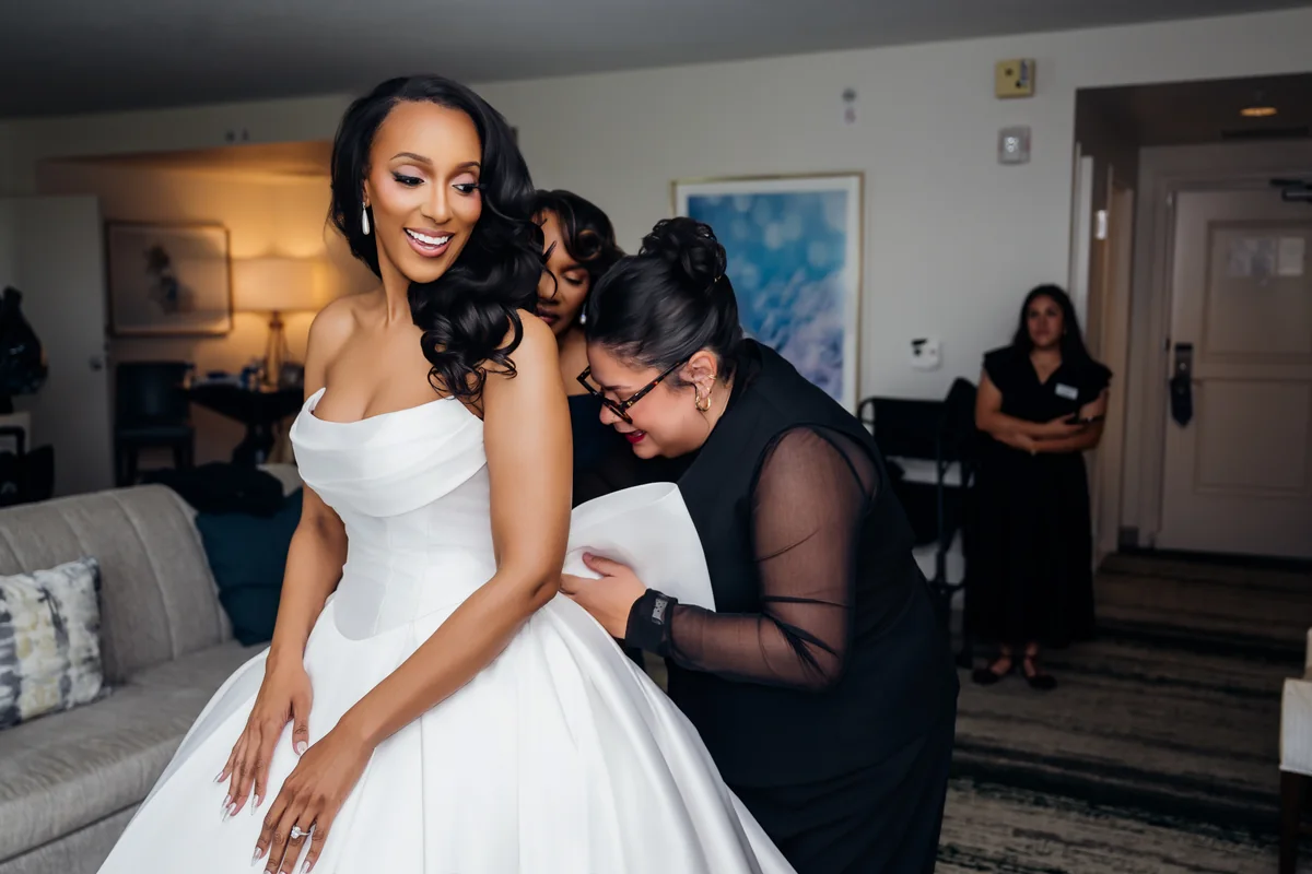 Jasmine getting ready in her bridal robe before the wedding