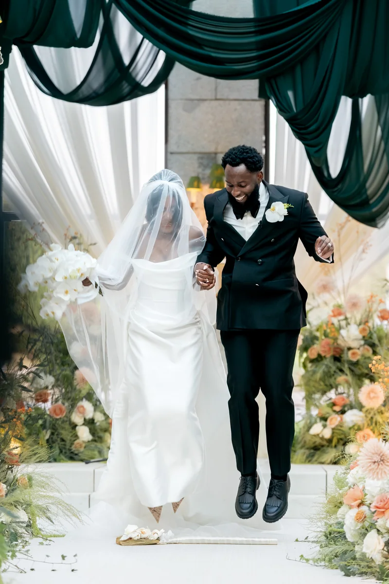 Jovan and Jalin walking together after their wedding ceremony