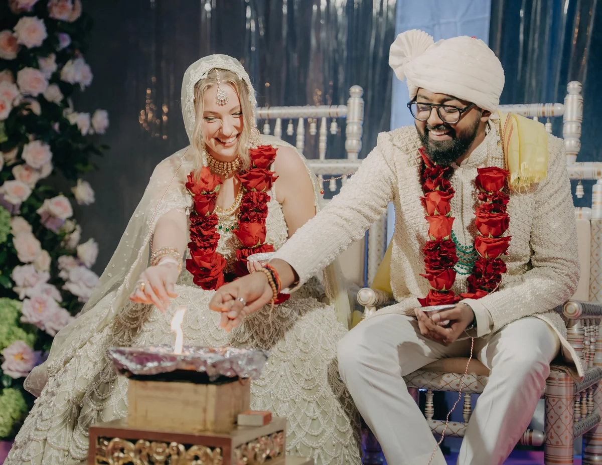 Megan and Karan sharing a moment during their traditional wedding ceremony