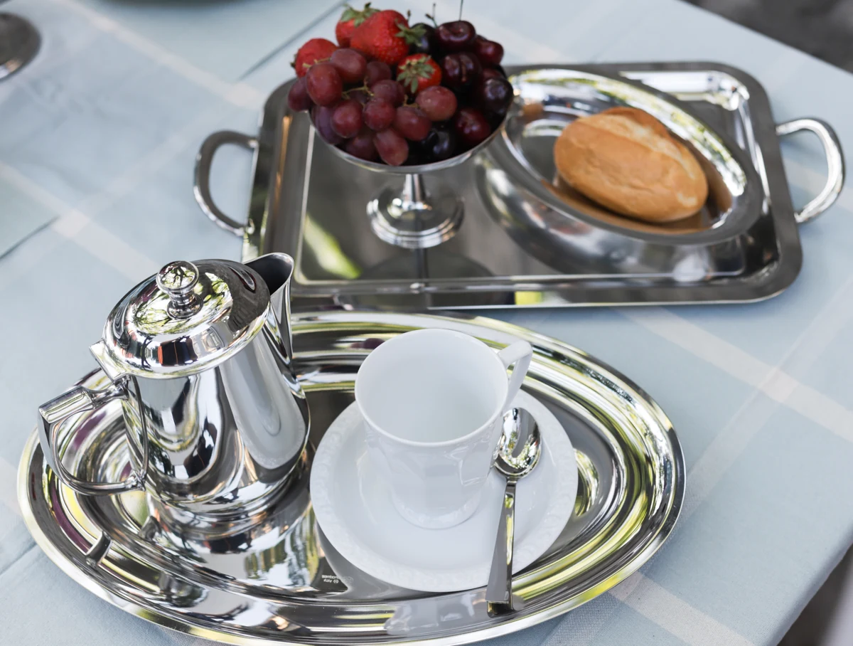 Sambonet Elite tea service with a cup, pastries and fruit