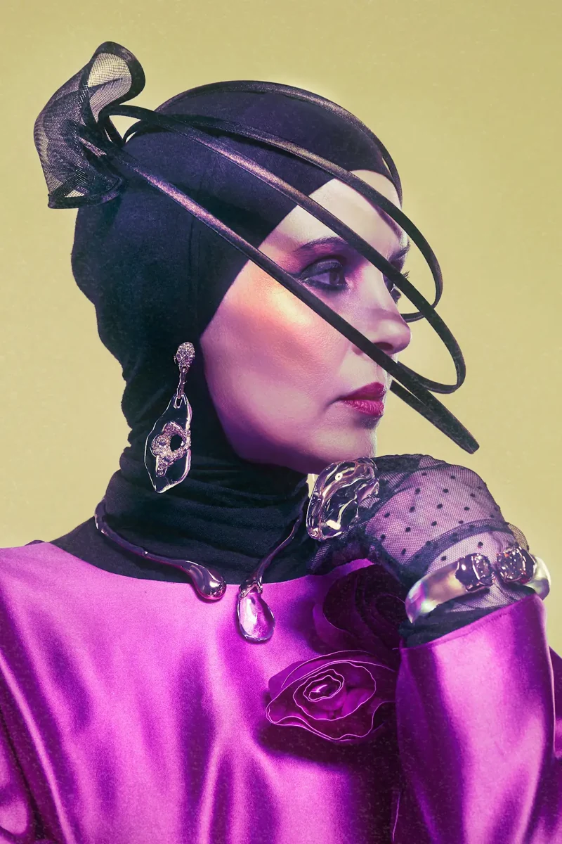 Samia Benchaou’s sculptural hat and Alexis Bittar statement jewelry
