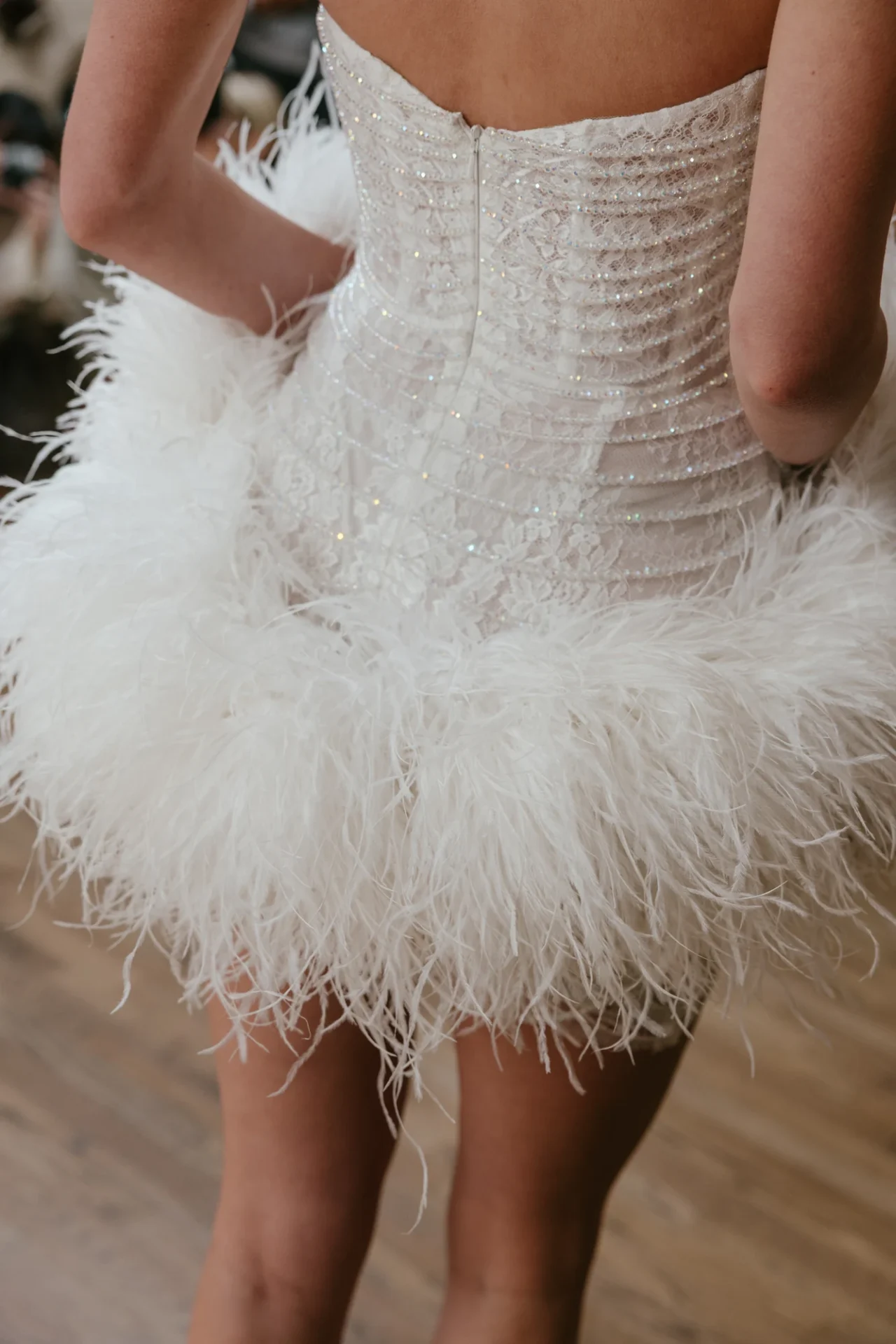 A feathered short bridal look from Francesca Miranda’s Fall 2027 collection