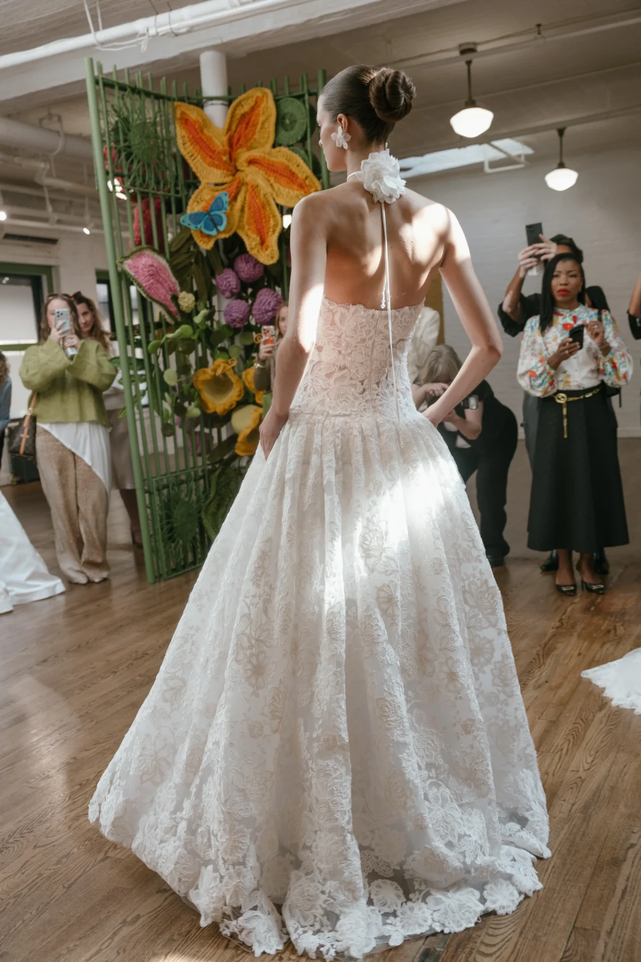 A floral lace wedding dress shown at the Fall 2027 presentation