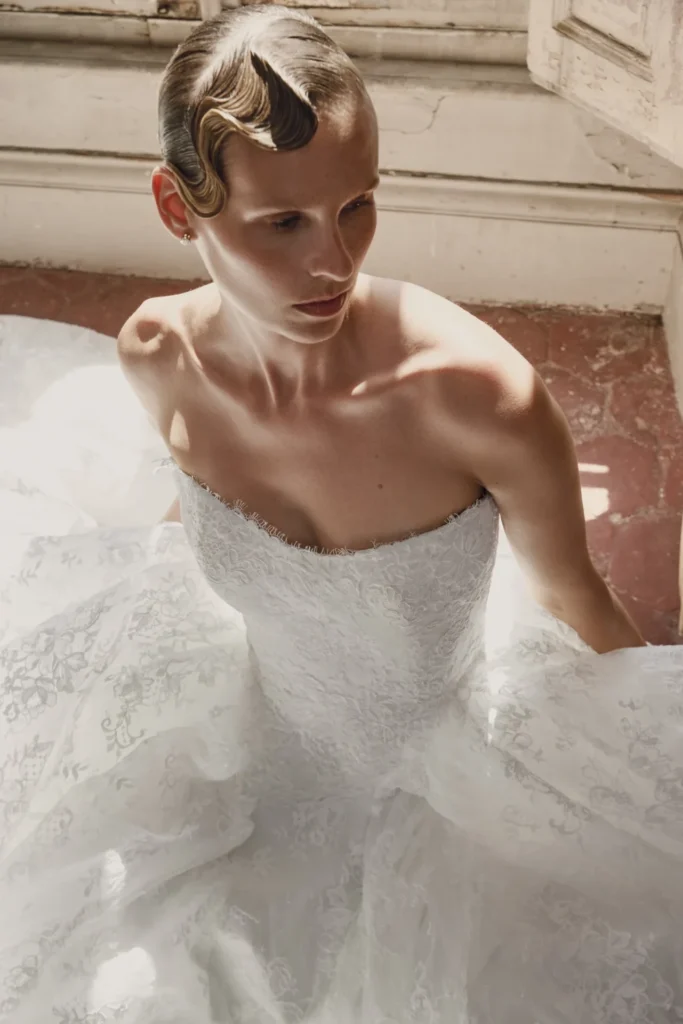 Close view of sculpted finger waves and understated makeup with the Anima lace wedding dress.