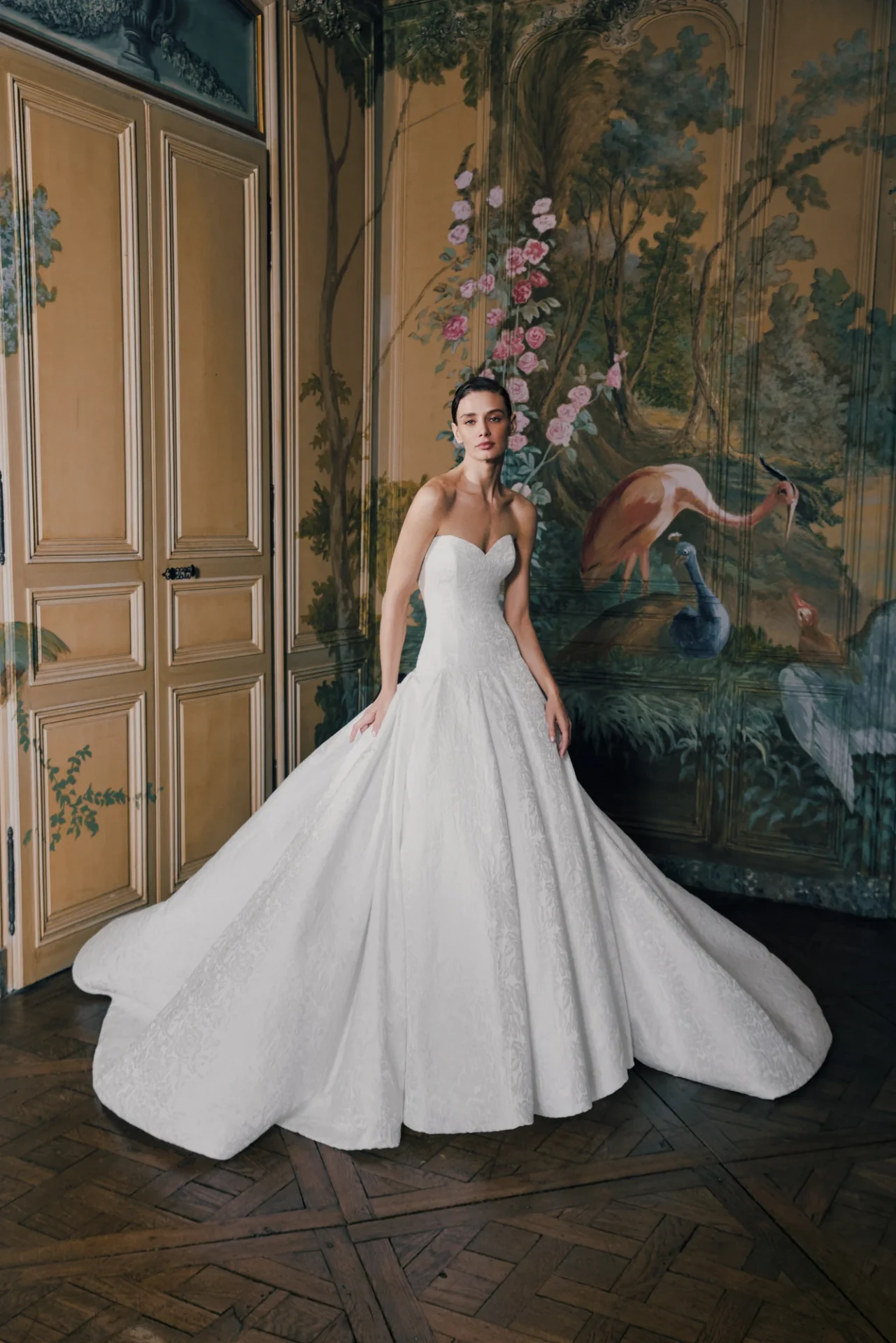 Harmonia strapless ball gown with a fitted bodice and floral texture in the Crescendo lookbook.