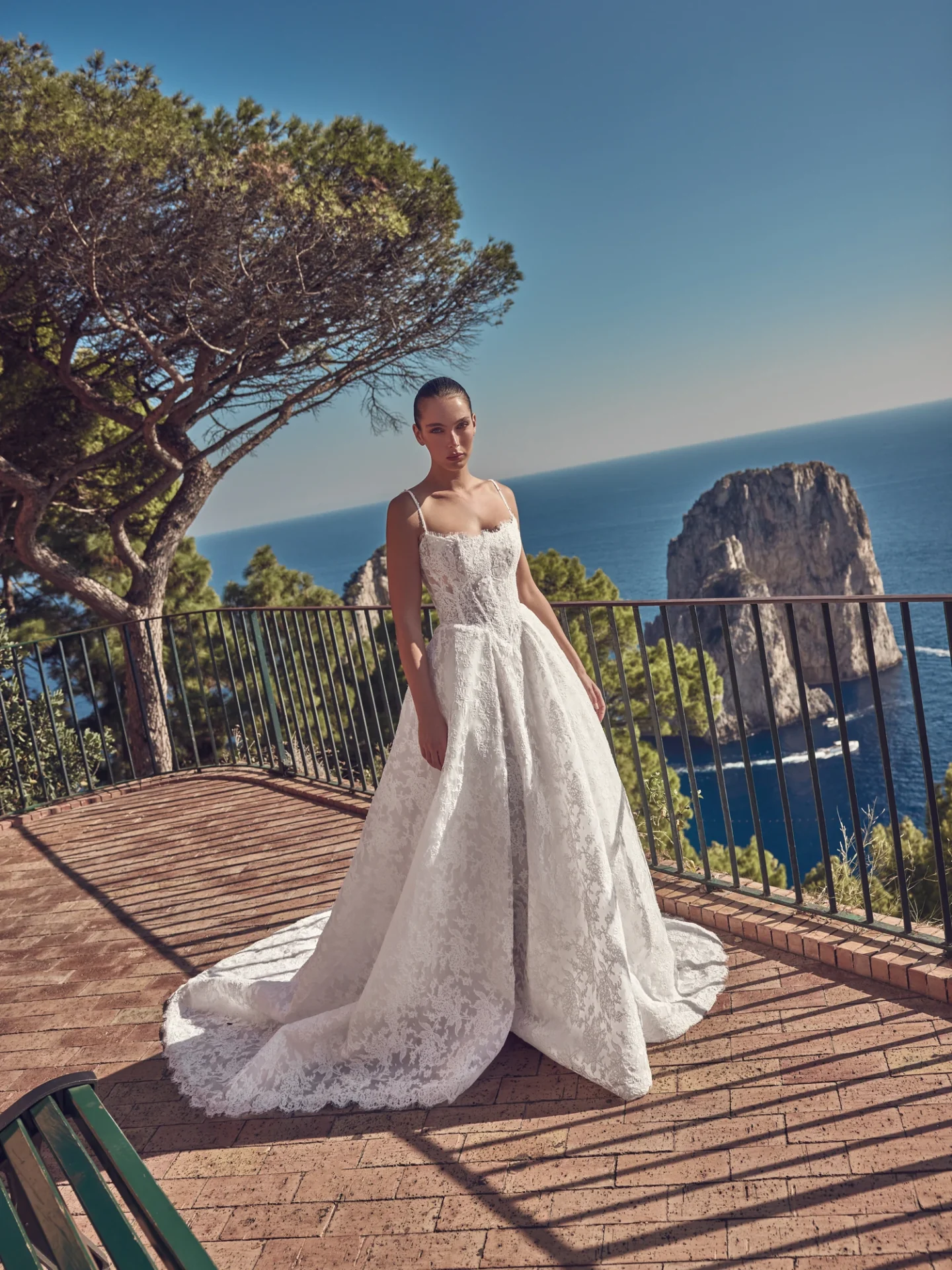 Ricca Sposa Couture Capri 2028 style 28-003, a lace ball gown with slim straps and a full skirt.
