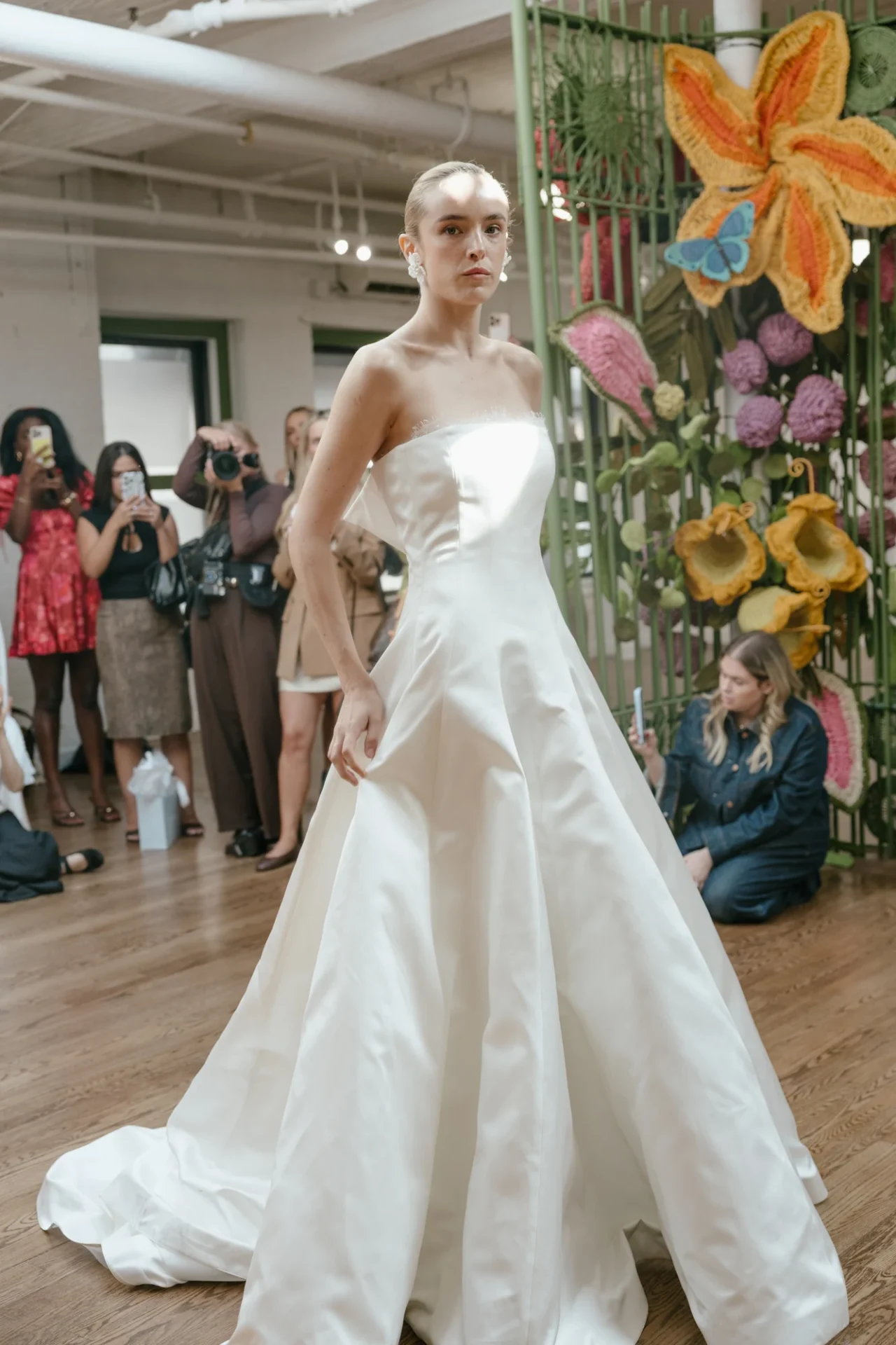 A clean-lined satin A-line gown from the Floresta presentation